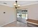 Dining area includes glass doors leading to the screened in patio at 1011 Bacon Ave, Sarasota, FL 34232