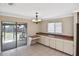 View of dining area with built-in cabinetry and sliding glass doors to the screened patio at 1011 Bacon Ave, Sarasota, FL 34232