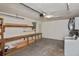 Garage area with laundry appliances, workbench, and shelving, offering a practical space for projects and storage at 1011 Bacon Ave, Sarasota, FL 34232