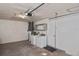 Functional garage space with washer, dryer, and storage options, providing convenience and organization for homeowners at 1011 Bacon Ave, Sarasota, FL 34232