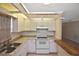 This kitchen features modern appliances, a double sink, and a breakfast bar at 1011 Bacon Ave, Sarasota, FL 34232