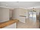 Open-concept living area with tile flooring and views of the screened patio at 1011 Bacon Ave, Sarasota, FL 34232
