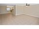 Spacious living room featuring tile flooring, neutral walls, and abundant natural light, perfect for comfortable living at 1011 Bacon Ave, Sarasota, FL 34232