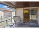 Cozy covered patio with sliding glass door leads to kitchen at 1011 Bacon Ave, Sarasota, FL 34232
