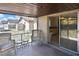 Covered patio seating area offers view of fenced yard at 1011 Bacon Ave, Sarasota, FL 34232