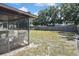 Enjoy relaxing on the screened porch overlooking the spacious yard at 1011 Bacon Ave, Sarasota, FL 34232