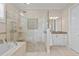 Modern bathroom with a large glass shower and a separate soaking tub at 1021 Crescent St # 1, Sarasota, FL 34242