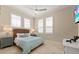 Cozy bedroom with a wicker bed frame and beach-themed decor at 1021 Crescent St # 1, Sarasota, FL 34242