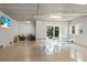 Finished garage with a ping pong table, storage, and bikes at 1021 Crescent St # 1, Sarasota, FL 34242