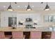 Kitchen featuring stainless steel appliances, granite counters, white cabinets, and stylish bar stool seating at 1021 Crescent St # 1, Sarasota, FL 34242