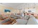 Comfortable and modern living room area with plenty of seating space and beach-themed decor at 1021 Crescent St # 1, Sarasota, FL 34242