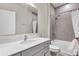 Clean bathroom featuring a single sink vanity with storage, a tiled shower over tub and neutral colors at 10616 High Noon Trl, Parrish, FL 34219