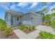 Attractive single-story home with tidy landscaping and a two-car garage at 10616 High Noon Trl, Parrish, FL 34219