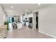 Open-concept kitchen with a central island, stainless appliances, and tile floors at 10616 High Noon Trl, Parrish, FL 34219