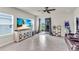 Spacious living room with large windows, tile flooring, and an open layout at 10616 High Noon Trl, Parrish, FL 34219
