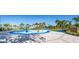 Community splash pad with various water features and play structures, providing a fun and safe environment for children to play at 10616 High Noon Trl, Parrish, FL 34219