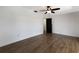 Bright bedroom with ceiling fan and laminate floors at 10712 Forest Run Dr, Bradenton, FL 34211