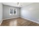 Neutral bedroom features laminate floors and a window bringing in natural light at 10712 Forest Run Dr, Bradenton, FL 34211