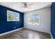 Stylish bedroom features laminate floors and windows at 10712 Forest Run Dr, Bradenton, FL 34211