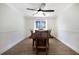 Bright dining room with wooden table and chairs and natural light at 10712 Forest Run Dr, Bradenton, FL 34211