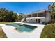 Back of house overlooking a sparkling pool at 10712 Forest Run Dr, Bradenton, FL 34211