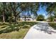 Beautiful two-story home with a spacious front yard and a long driveway, perfect for a Gathering at 10712 Forest Run Dr, Bradenton, FL 34211