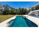 This pool has a beautiful lawn view at 10712 Forest Run Dr, Bradenton, FL 34211
