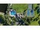 Aerial view of pool, tennis and basketball courts, a club house, and plenty of parking at 10806 52Nd E Ct, Parrish, FL 34219