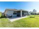 Rear of home with a screened-in porch and a brick paver patio at 10806 52Nd E Ct, Parrish, FL 34219