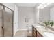 Bright bathroom featuring double sinks with granite counters and a glass enclosed shower at 10806 52Nd E Ct, Parrish, FL 34219