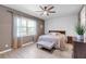 Well lit bedroom featuring a ceiling fan, a window, wood flooring and a neutral color palette at 10806 52Nd E Ct, Parrish, FL 34219