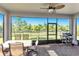 Relax on the covered patio, complete with a ceiling fan and outdoor kitchen area with a grill at 10806 52Nd E Ct, Parrish, FL 34219