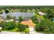 Beautiful lakefront home with a screened-in pool and mature landscaping at 11215 Rivers Bluff Cir, Lakewood Ranch, FL 34202