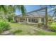The screened pool and patio with outdoor seating provide a relaxing outdoor retreat in the backyard at 11215 Rivers Bluff Cir, Lakewood Ranch, FL 34202