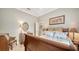 Comfortable bedroom showcases warm wood tones and ample natural light at 11215 Rivers Bluff Cir, Lakewood Ranch, FL 34202