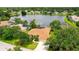 Charming home featuring a well-manicured front yard, screened pool and lush greenery at 11215 Rivers Bluff Cir, Lakewood Ranch, FL 34202