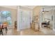 Inviting home foyer with tile floors, a large arched window, and an open layout at 11215 Rivers Bluff Cir, Lakewood Ranch, FL 34202