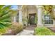 Charming front entrance with a decorative wreath and manicured landscaping at 11215 Rivers Bluff Cir, Lakewood Ranch, FL 34202
