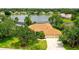 Beautiful lakefront home with a well-manicured lawn and lush landscaping at 11215 Rivers Bluff Cir, Lakewood Ranch, FL 34202