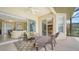 Relaxing screened lanai with cozy seating, an overhead fan, and access to the living areas at 11215 Rivers Bluff Cir, Lakewood Ranch, FL 34202