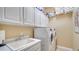 Laundry room with washer, dryer, and sink at 11215 Rivers Bluff Cir, Lakewood Ranch, FL 34202