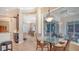 Bright living space with tile flooring, neutral walls, and dining area, adjacent to the kitchen at 11215 Rivers Bluff Cir, Lakewood Ranch, FL 34202