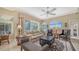 Comfortable living room with neutral decor, large windows, and abundant natural light at 11215 Rivers Bluff Cir, Lakewood Ranch, FL 34202