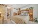 Spacious main bedroom featuring a well-placed dresser and ensuite bathroom at 11215 Rivers Bluff Cir, Lakewood Ranch, FL 34202