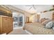 Open main bedroom with slider door access to the outdoor living space at 11215 Rivers Bluff Cir, Lakewood Ranch, FL 34202