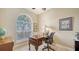 Inviting home office with a large window and classic wooden desk at 11215 Rivers Bluff Cir, Lakewood Ranch, FL 34202