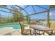 Outdoor patio with view of pool and lake at 11215 Rivers Bluff Cir, Lakewood Ranch, FL 34202