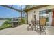 Covered outdoor patio overlooking the lake at 11215 Rivers Bluff Cir, Lakewood Ranch, FL 34202