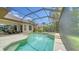 A screened-in pool and patio area with a built-in spa and outdoor seating at 11215 Rivers Bluff Cir, Lakewood Ranch, FL 34202