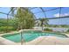 Screened in pool overlooking a serene lake, perfect for relaxing at 11215 Rivers Bluff Cir, Lakewood Ranch, FL 34202